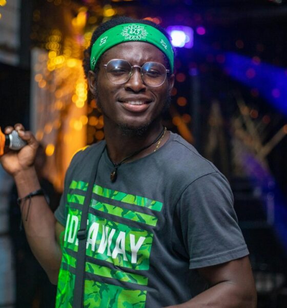 Ghanaian rapper performing on stage, illustrating Okyeame Kwame's Citi Business Olympics appearance