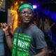 Ghanaian rapper performing on stage, illustrating Okyeame Kwame's Citi Business Olympics appearance